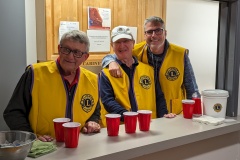 Lions Eric, Rick and Ken behind the bar.